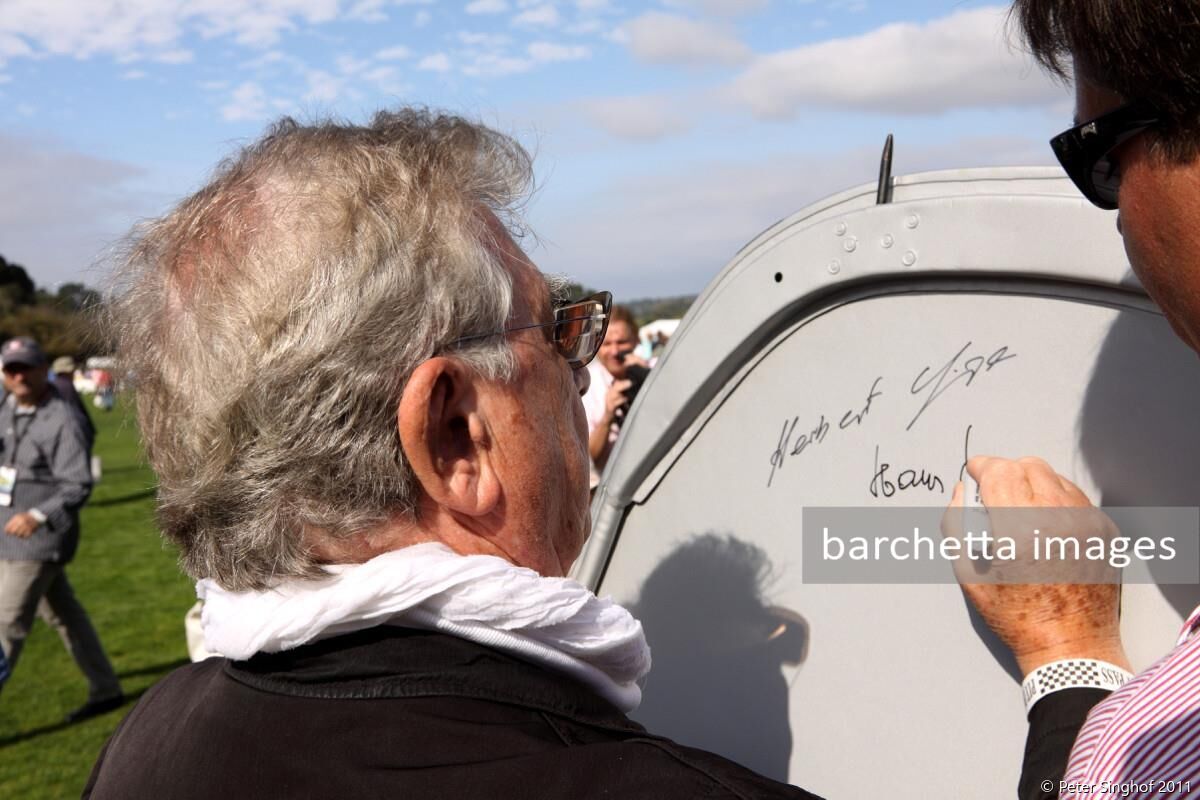 Hans Herrmann signing the bonnet of 1959 Porsche RSK Spyder s/n 718-016