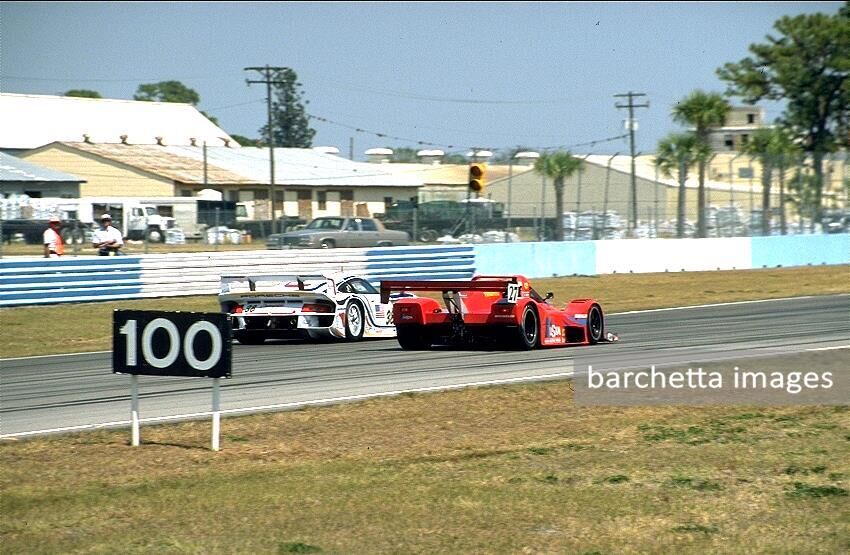 The 333 SP s/n 025 of Didier Theys, Mauro Baldi and Fredy Lienhard overtakes the Porsche GT1 of Boutsen/Wollek/Muller