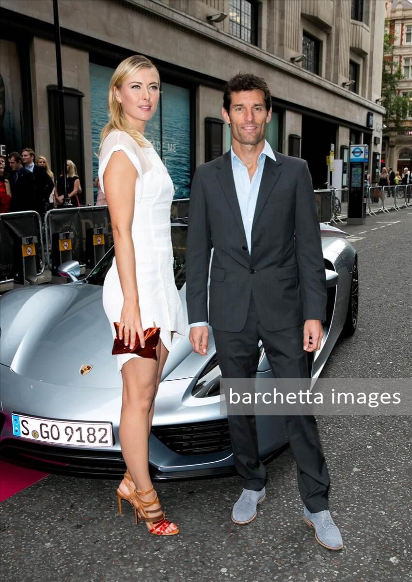 Porsche Brand Ambassadors Maria Sharapova and Mark Webber arrive with a Porsche 918 Spyder super sportscar for the WTA Pre-Wimbledon Party at Kensington Roof Gardens on June 19, 2014 in London, UK